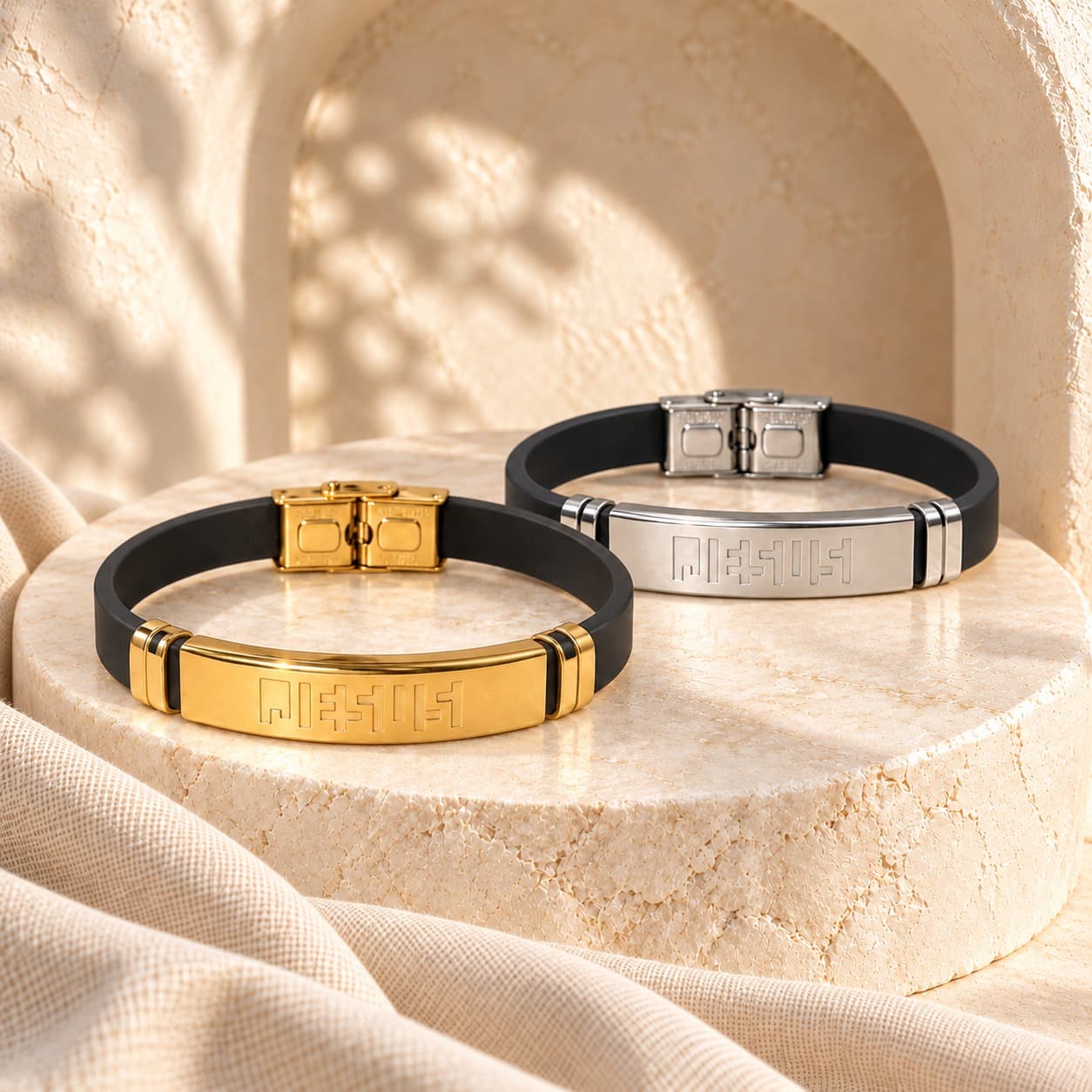 Gold and silver Behold Your Faith bracelets on a travertine plinth beneath a stone arch